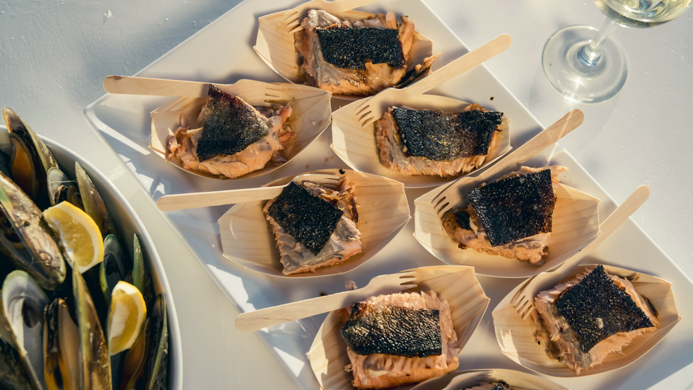 Delicious fresh salmon and mussels are served aboard Marlborough Tour Company's Seafood Odyssea cruise from Picton in New Zealand's Marlborough Sounds.