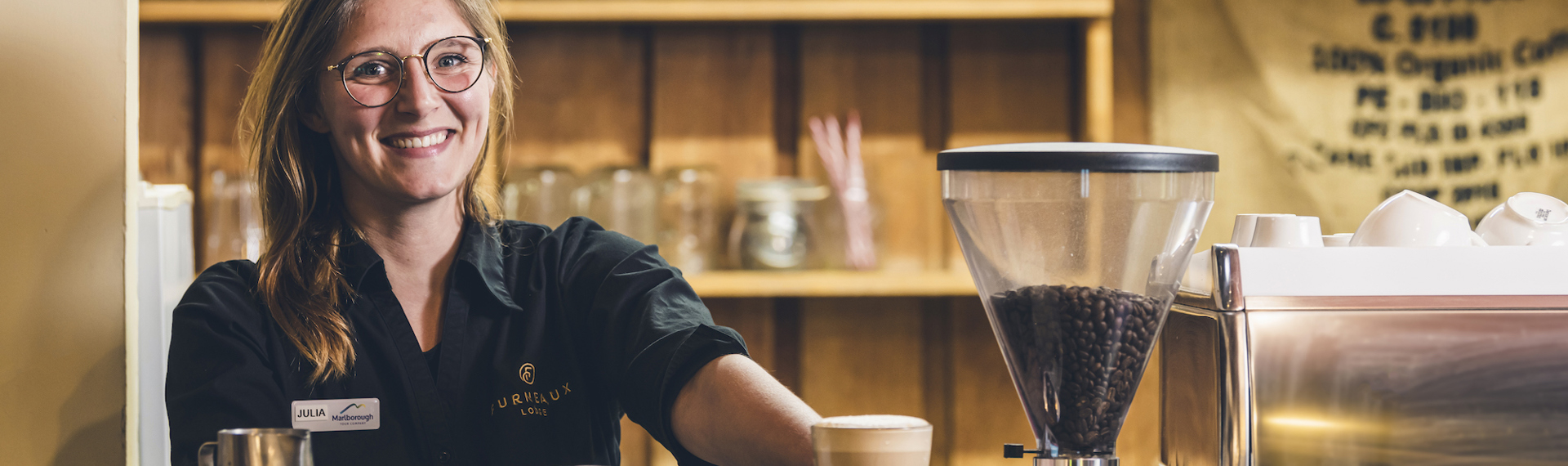 A barista makes coffee at the Furneaux Lodge Restaurant in the Marlborough Sounds at the top of New Zealand's South Island.