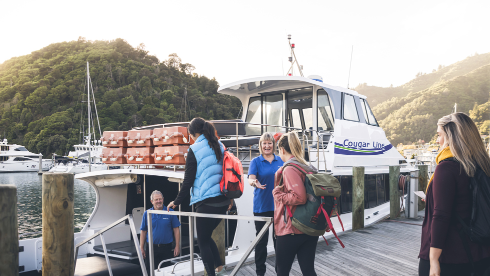 Cougar Line passengers board their boat in Picton Marina in the Marlborough Sounds, New Zealand.